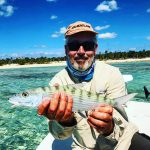 Warm sunshine, sandy beach, clearest of oceans and a Bonefish in your hand! Can